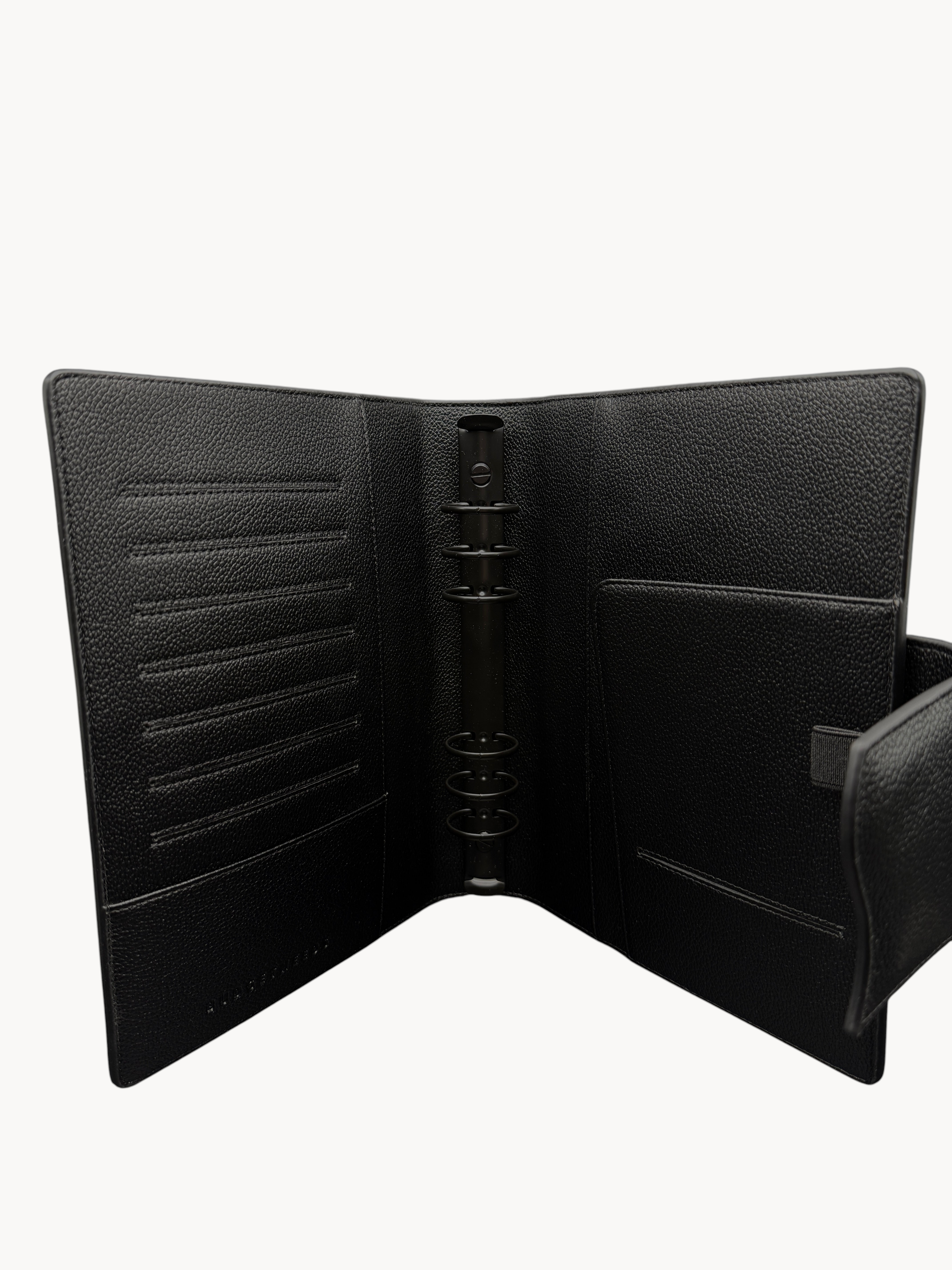 BUDGETNEEDS ™ A5 MiniFlap ring binder in black textured material with matte black hardware and pen holder