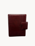 BUDGETNEEDS ™ A5 MiniFlap ring binder in ruby red with a crocodile texture and magnetic button closure.