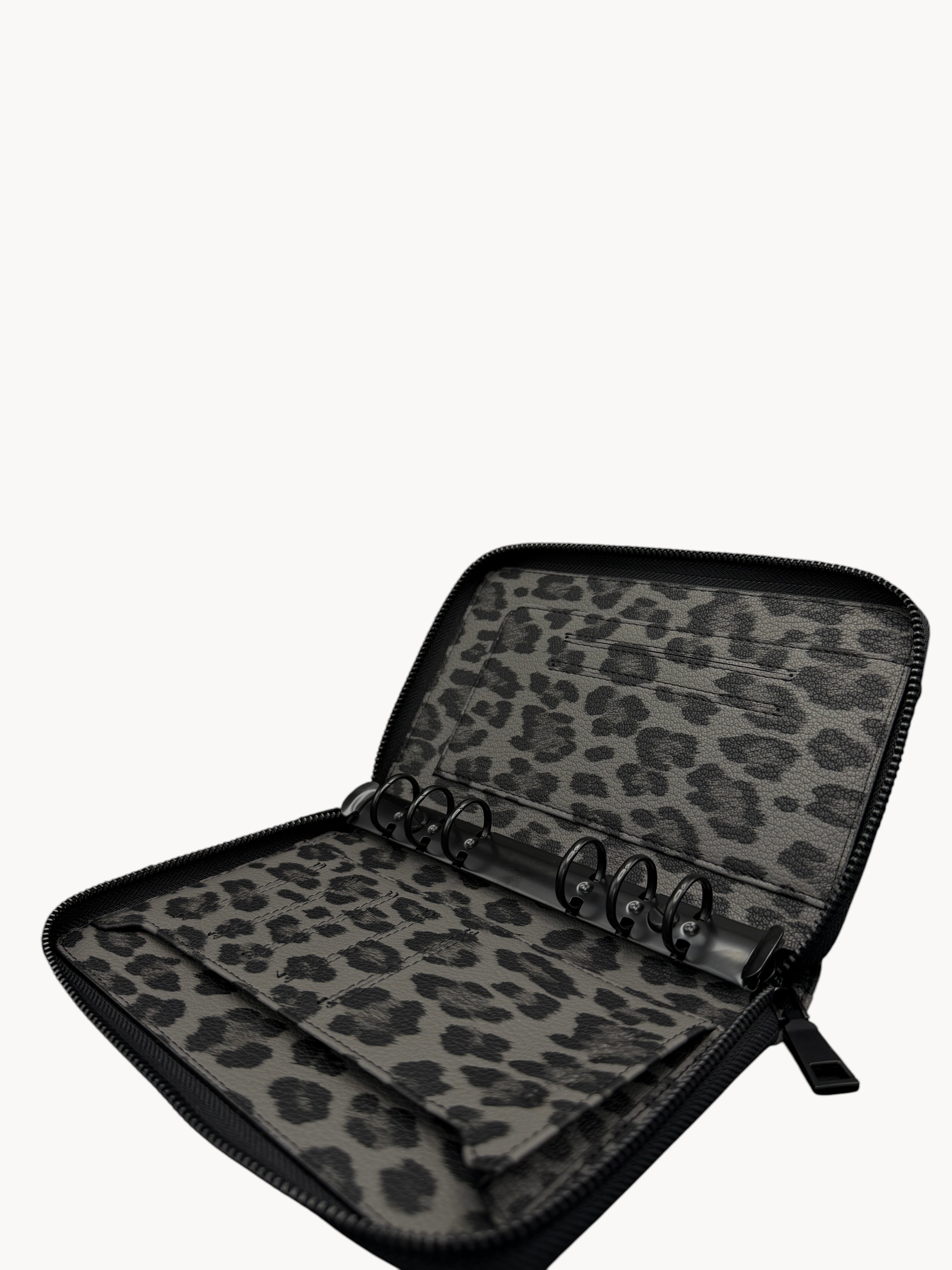 BUDGETNEEDS ™ A6 zip ring binder in grey leopard print with black hardware and interior card slots