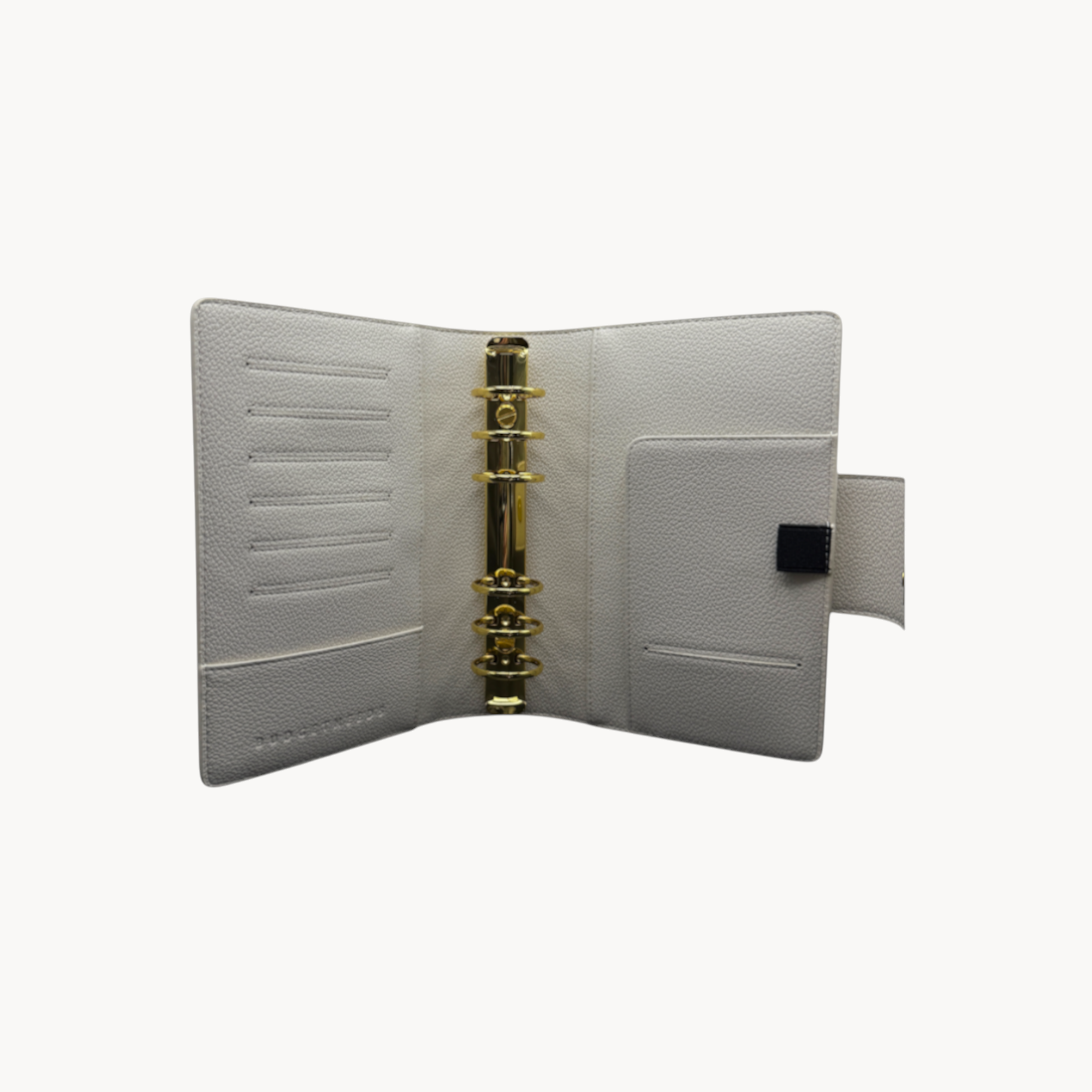 BUDGETNEEDS ™ A6 MiniFlap ring binder in cream with gold hardware, pen holder, and magnetic closure.