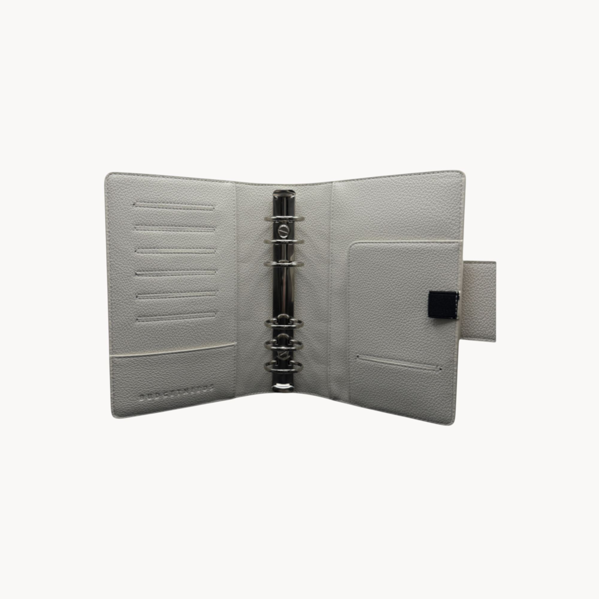 BUDGETNEEDS ™ A6 MiniFlap ring binder in cream with silver hardware, magnetic closure, and integrated pen holder.