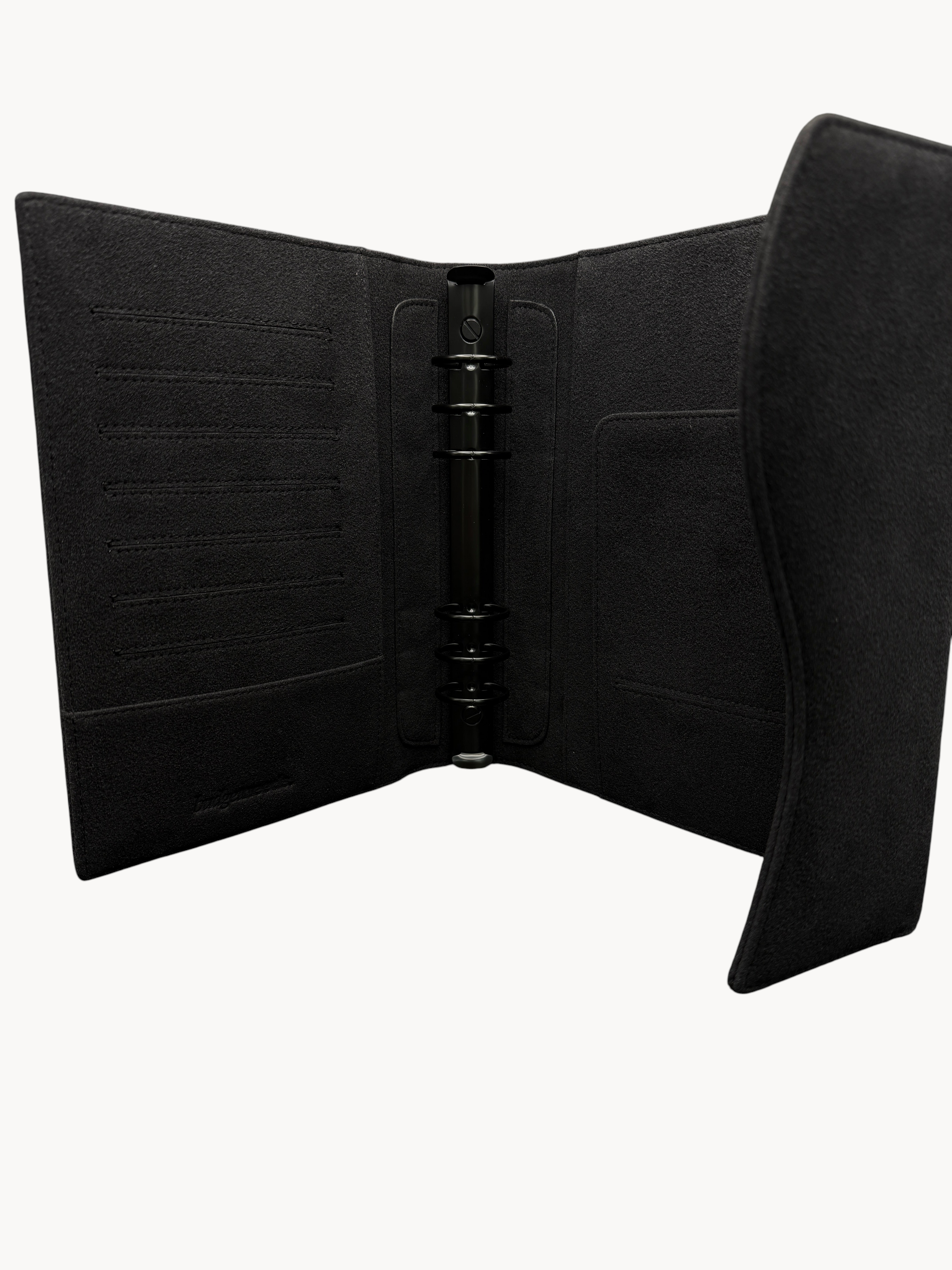 BUDGETNEEDS ™ black suede ring binder with internal card slots and a metal ring mechanism for organization.