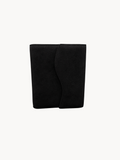 BUDGETNEEDS ™ black suede ring binder with a curved flap closure, shown from a front view against a plain background.
