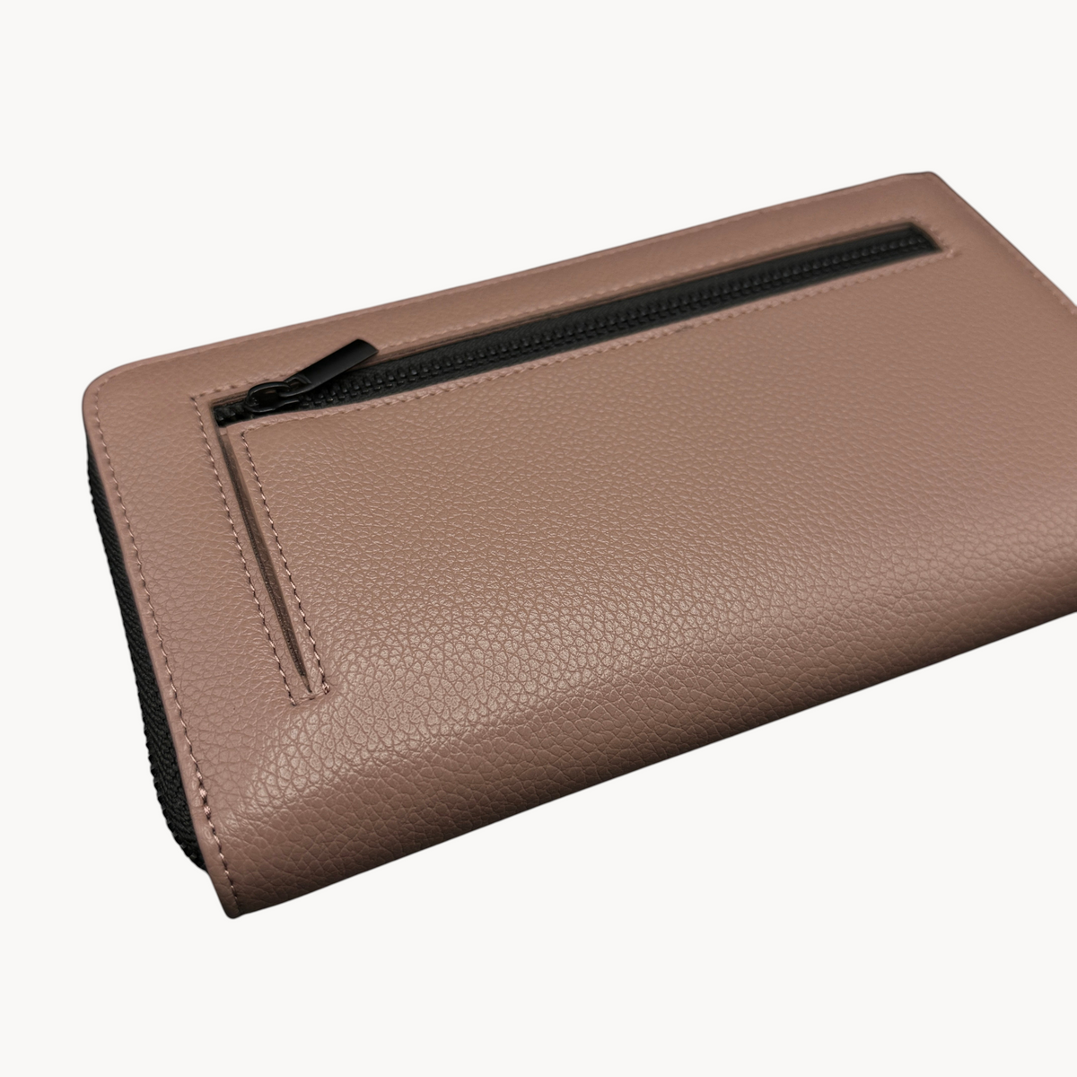 BUDGETNEEDS ™ blush pink zip wallet with a textured finish and a convenient exterior zippered coin pocket.
