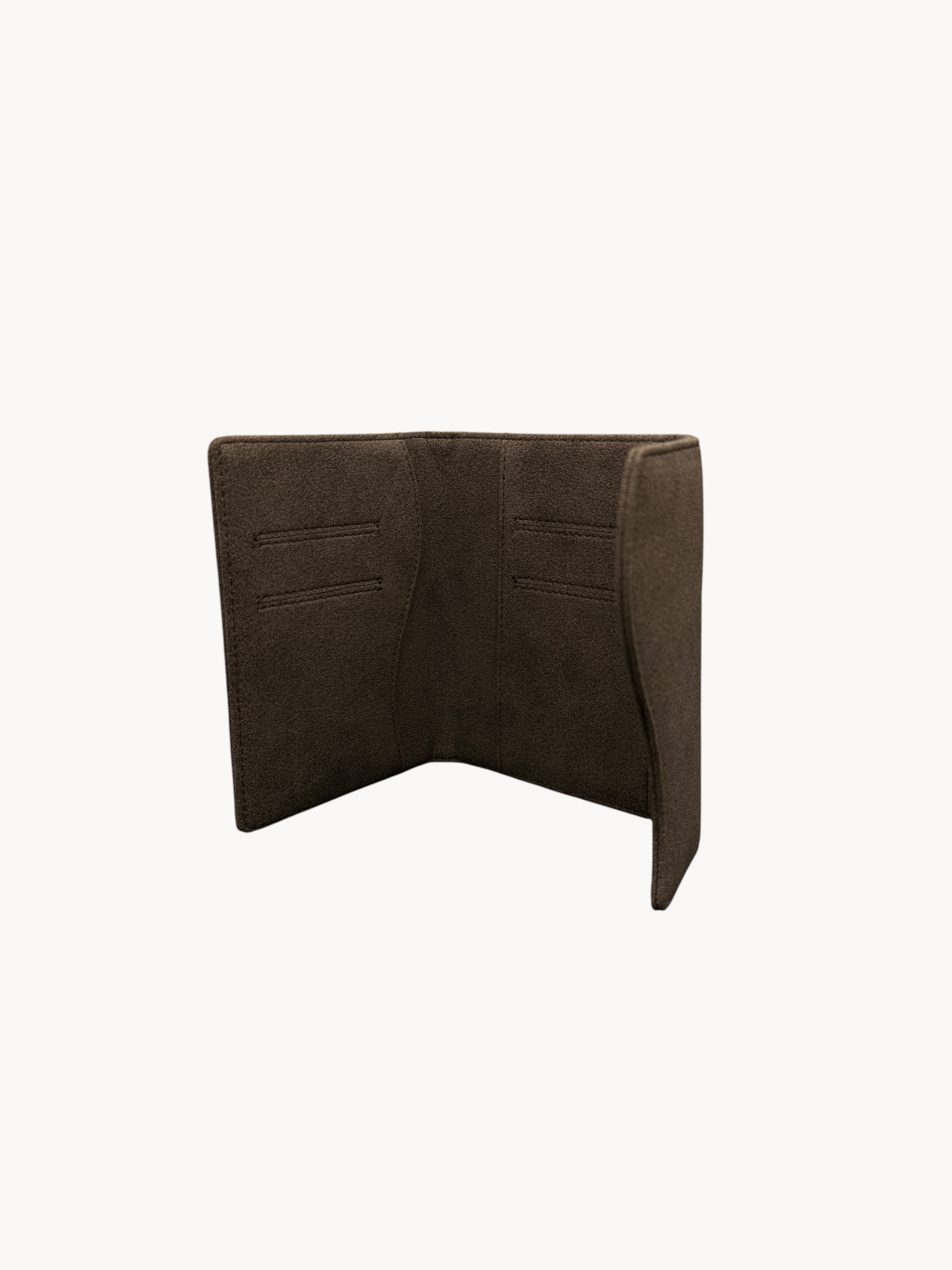 BUDGETNEEDS ™ brown passport cover with interior card slots, elegant travel accessory for passport protection.