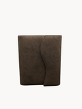 BUDGETNEEDS ™ brown suede ring binder with a curved flap closure, shown from the front against a white background.