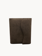 BUDGETNEEDS ™ brown suede ring binder with a curved flap closure, shown from the front against a white background.