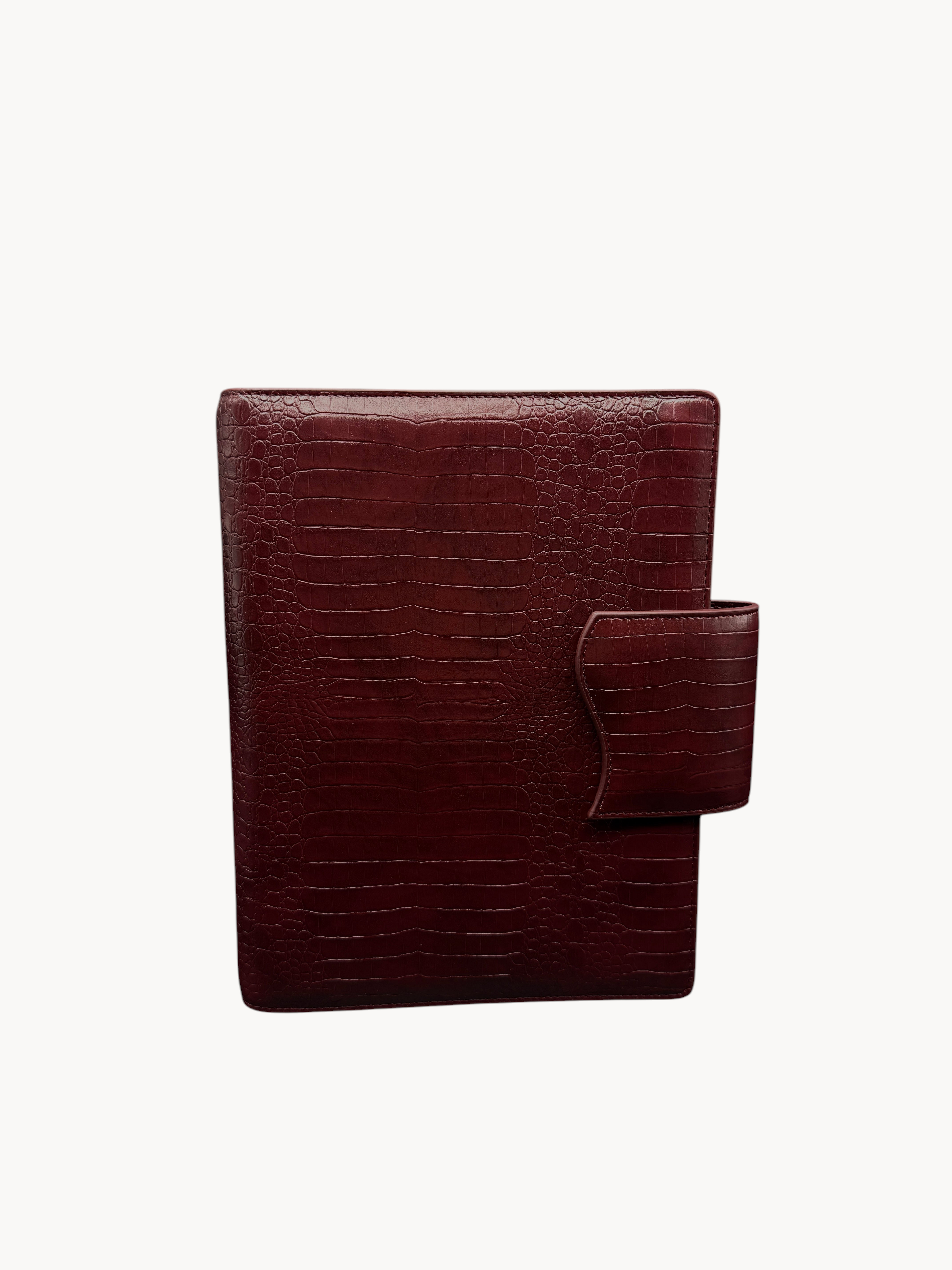BUDGETNEEDS ™ A5 MiniFlap ring binder in ruby red with a crocodile texture and magnetic button closure.