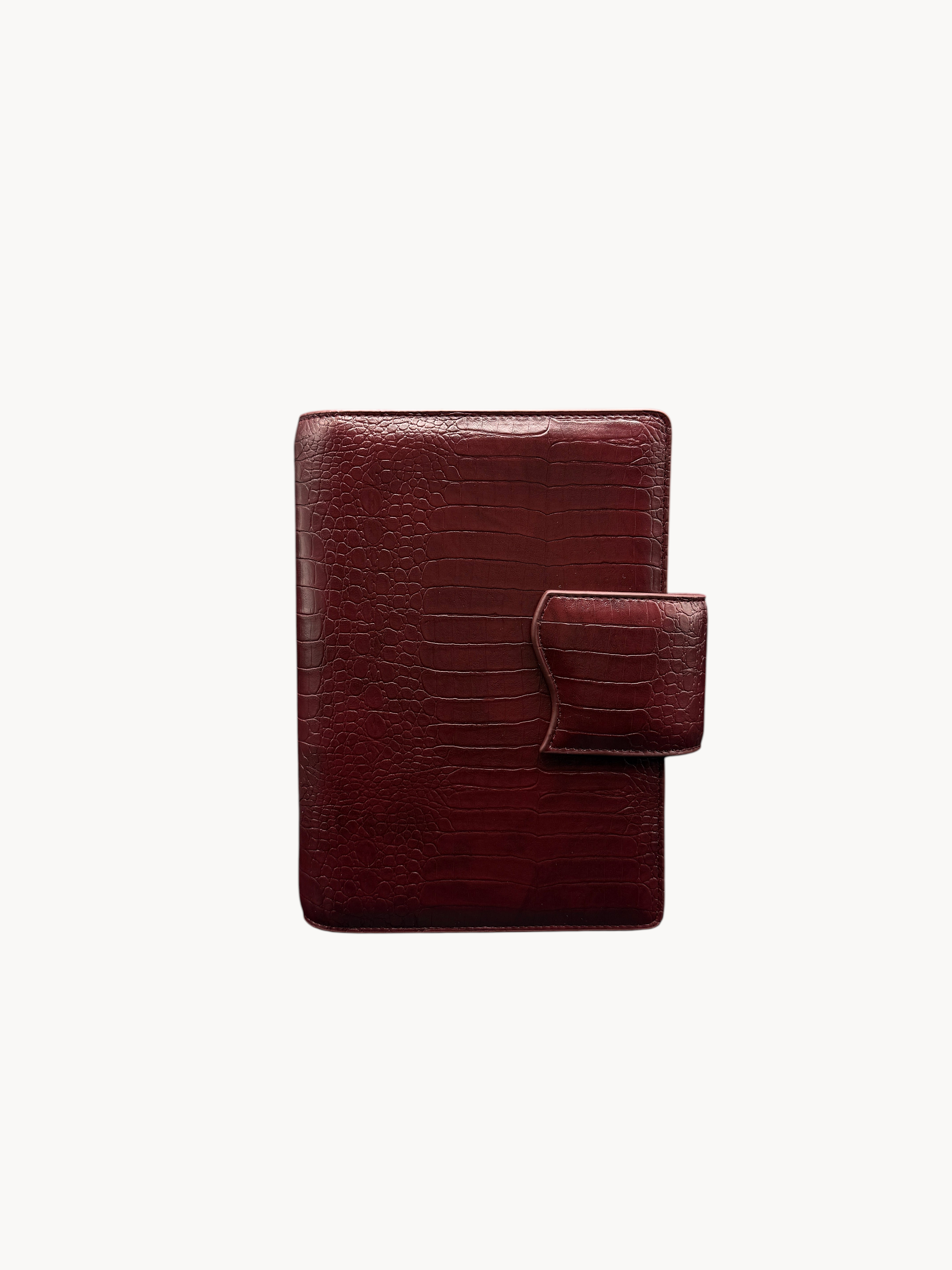 BUDGETNEEDS ™ A6 MiniFlap ring binder in ruby red with a crocodile texture and magnetic button closure.