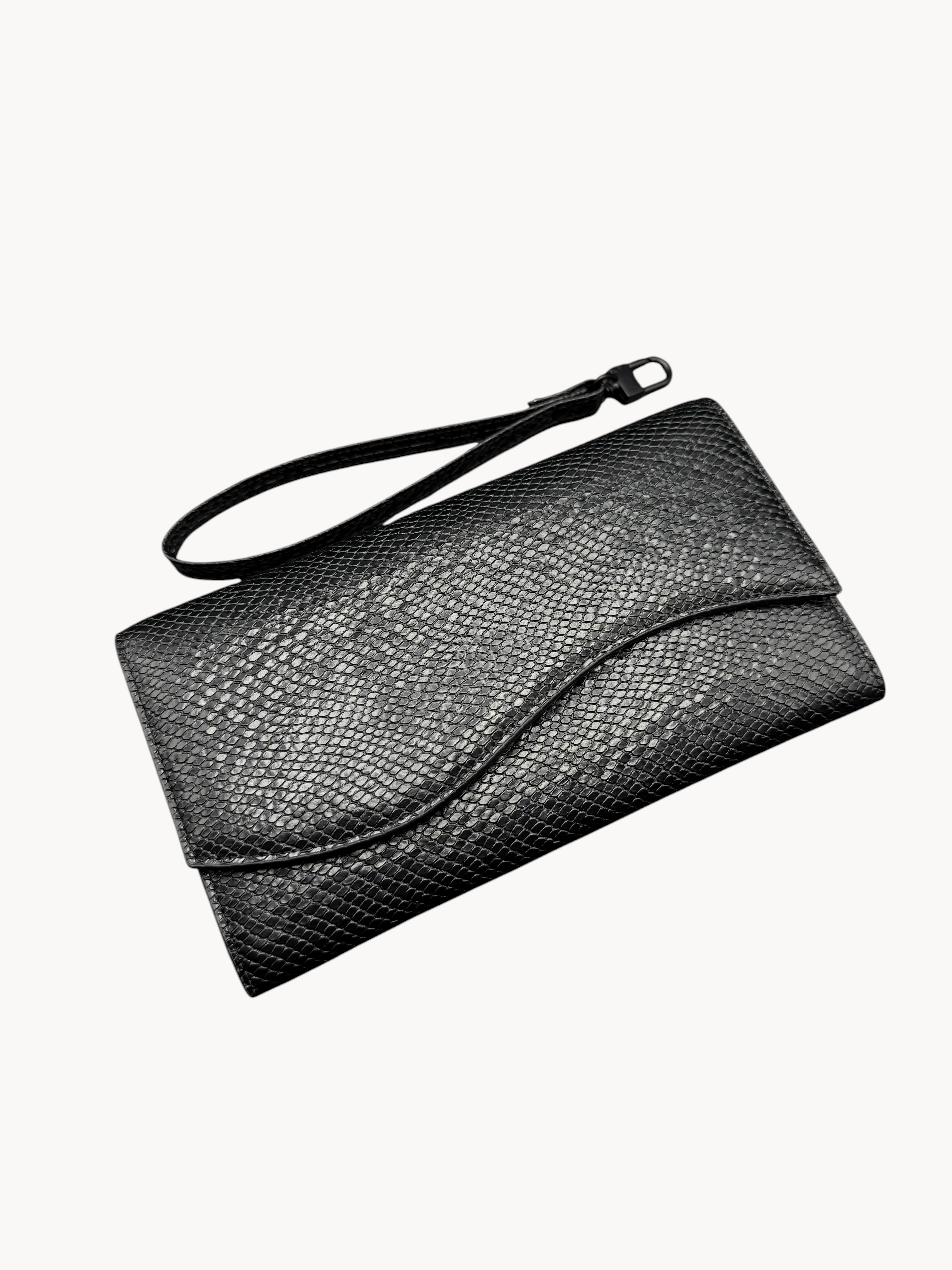 BUDGETNEEDS ™ Wallet Wave black snakeskin textured clutch purse with a wrist strap and minimalist flap design.