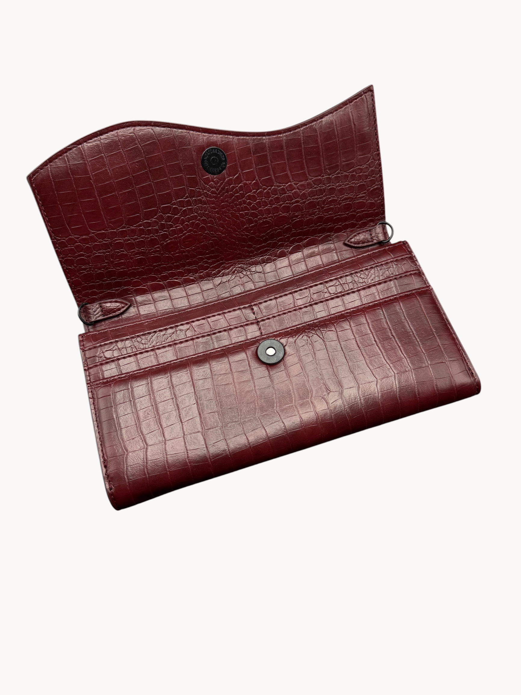 BUDGETNEEDS ™ Wallet Wave in deep burgundy with a crocodile-embossed texture and a sleek magnetic snap closure.