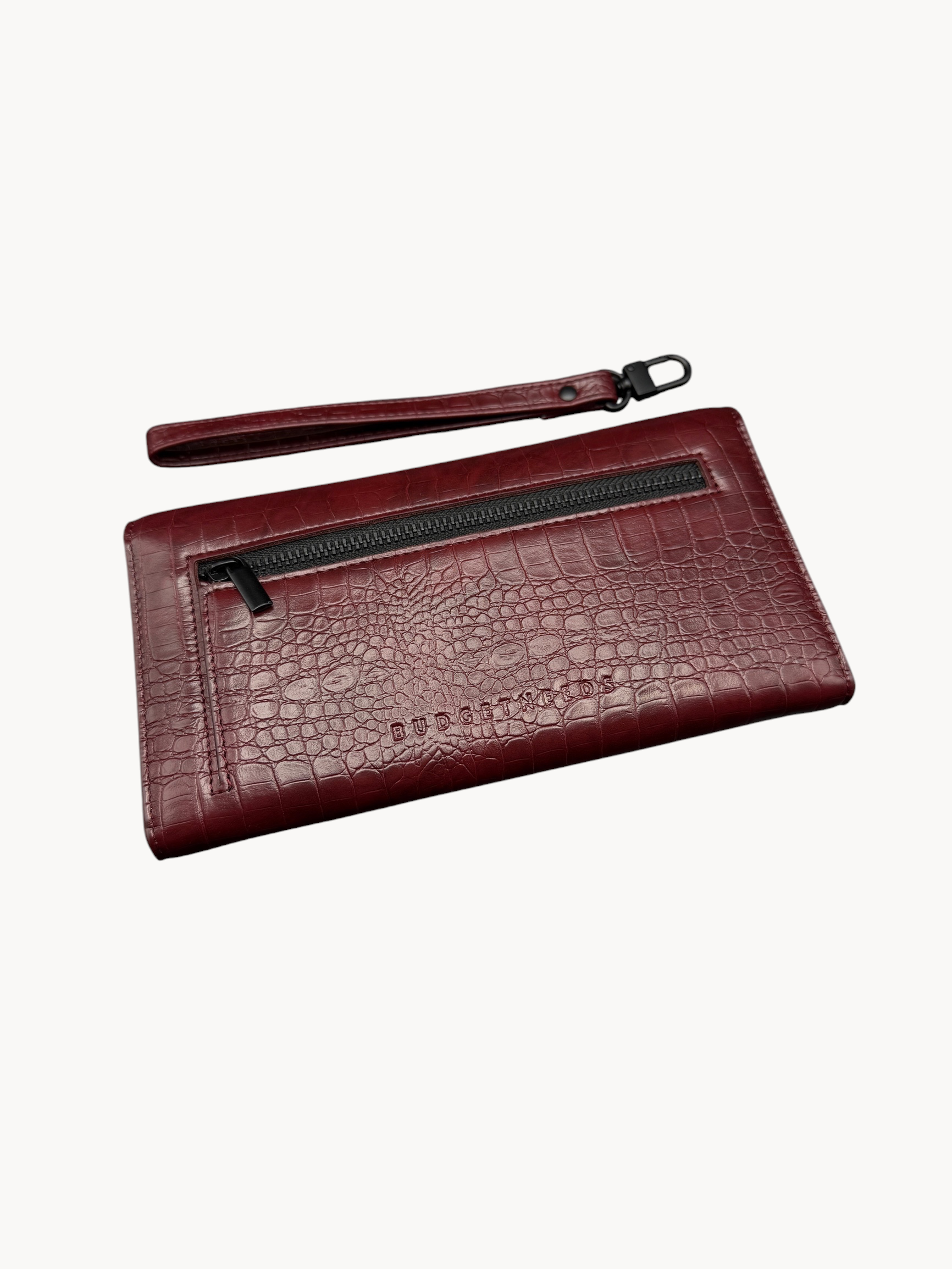 BUDGETNEEDS ™ Wallet Wave in dark red with crocodile embossed texture, featuring a back zipper pocket and wrist strap.